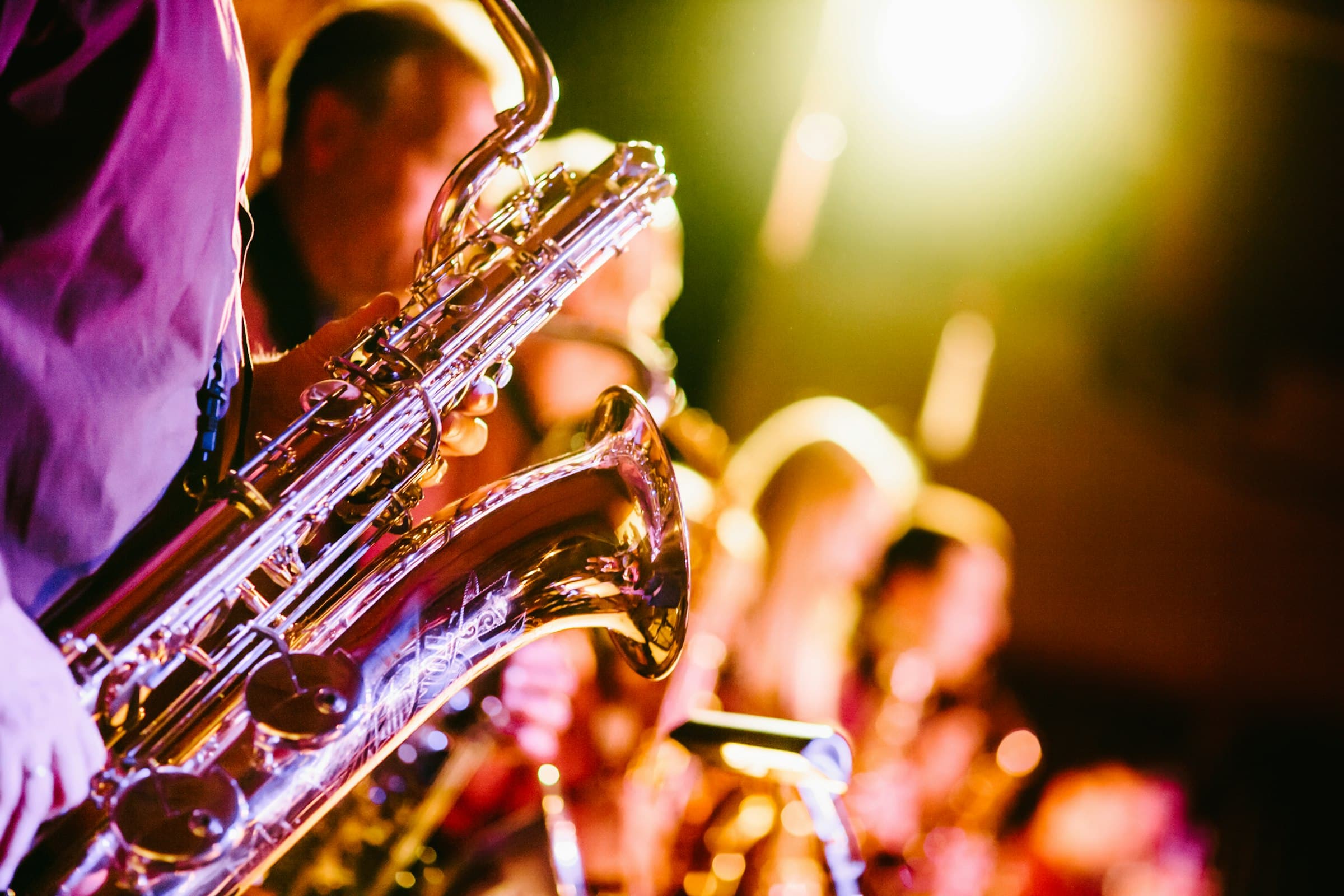 Saxophones catching warm stage light